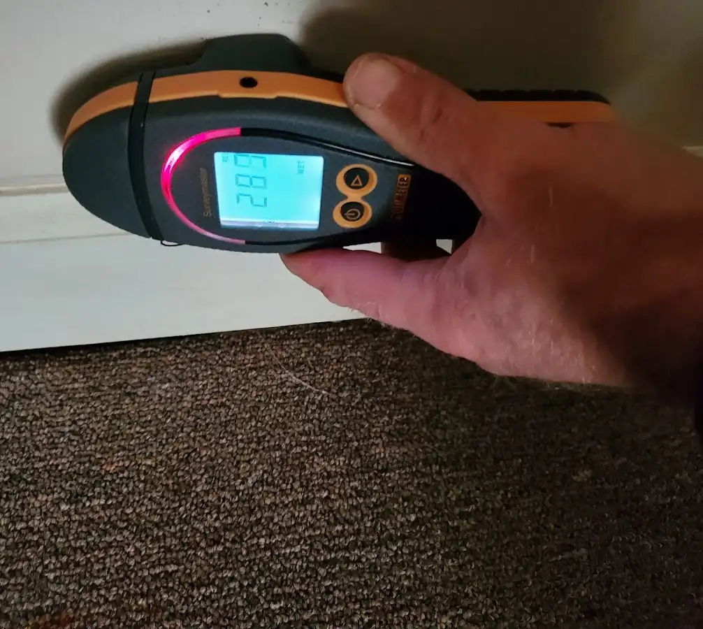 Moisture detection at baseboard during Storm Damage Restoration in Richfield